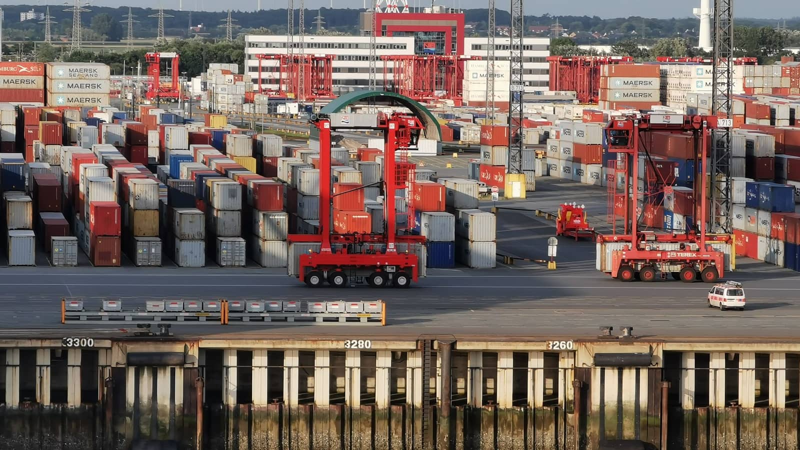 Aerial view of shipping containers and cranes at a cargo port